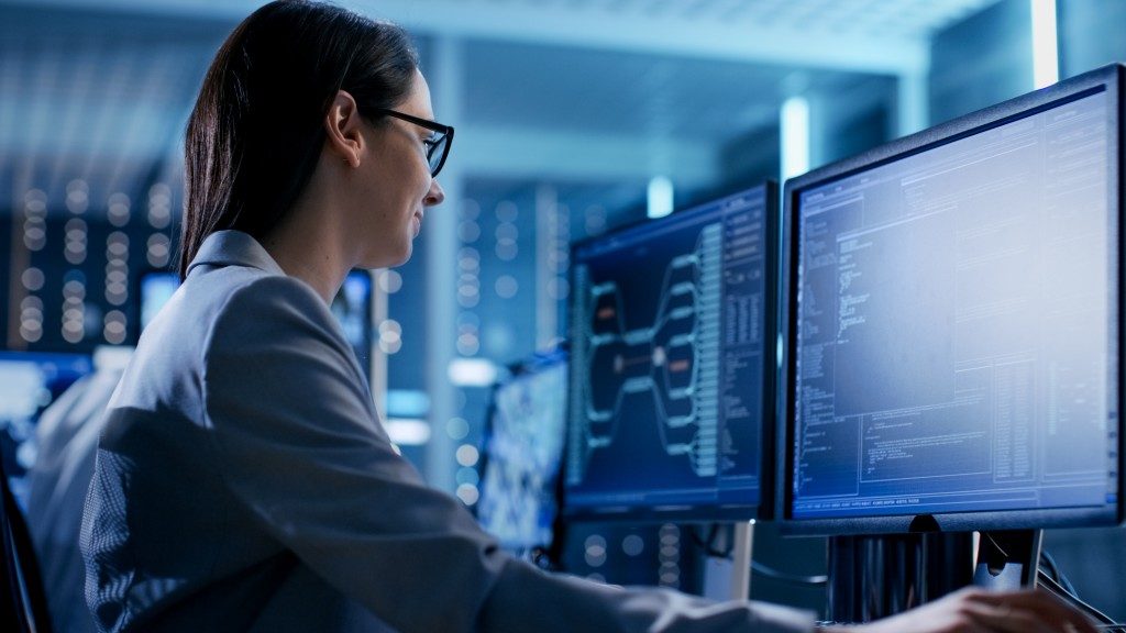 Close-up Shot of Female IT Engineer Working in Monitoring Room