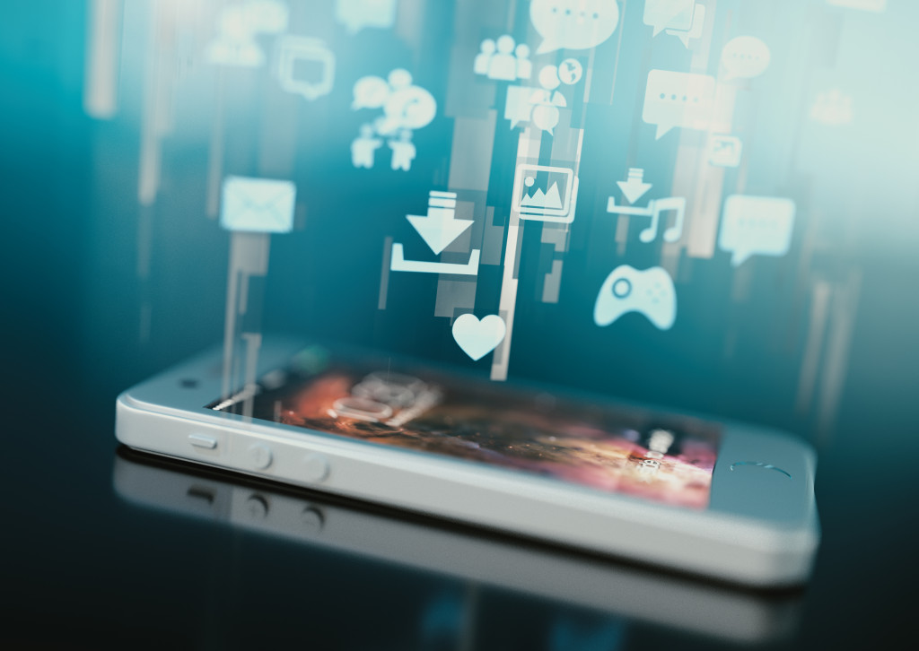 a smartphone with holographic apps floating above it